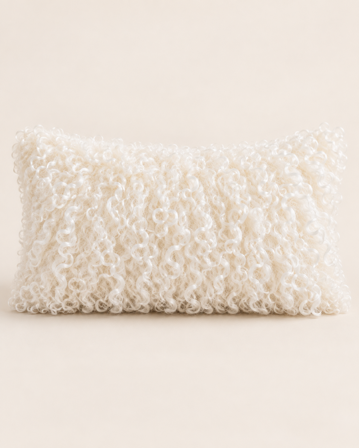 Woolsy ivory Mongolian sheepskin cushion, 12 x 20 product shot