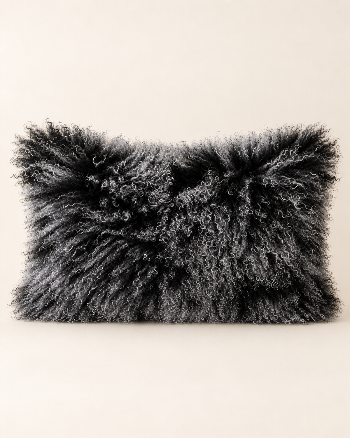 Black Snow Top Mongolian sheepskin cushion 12 x 20 inch studio product shot