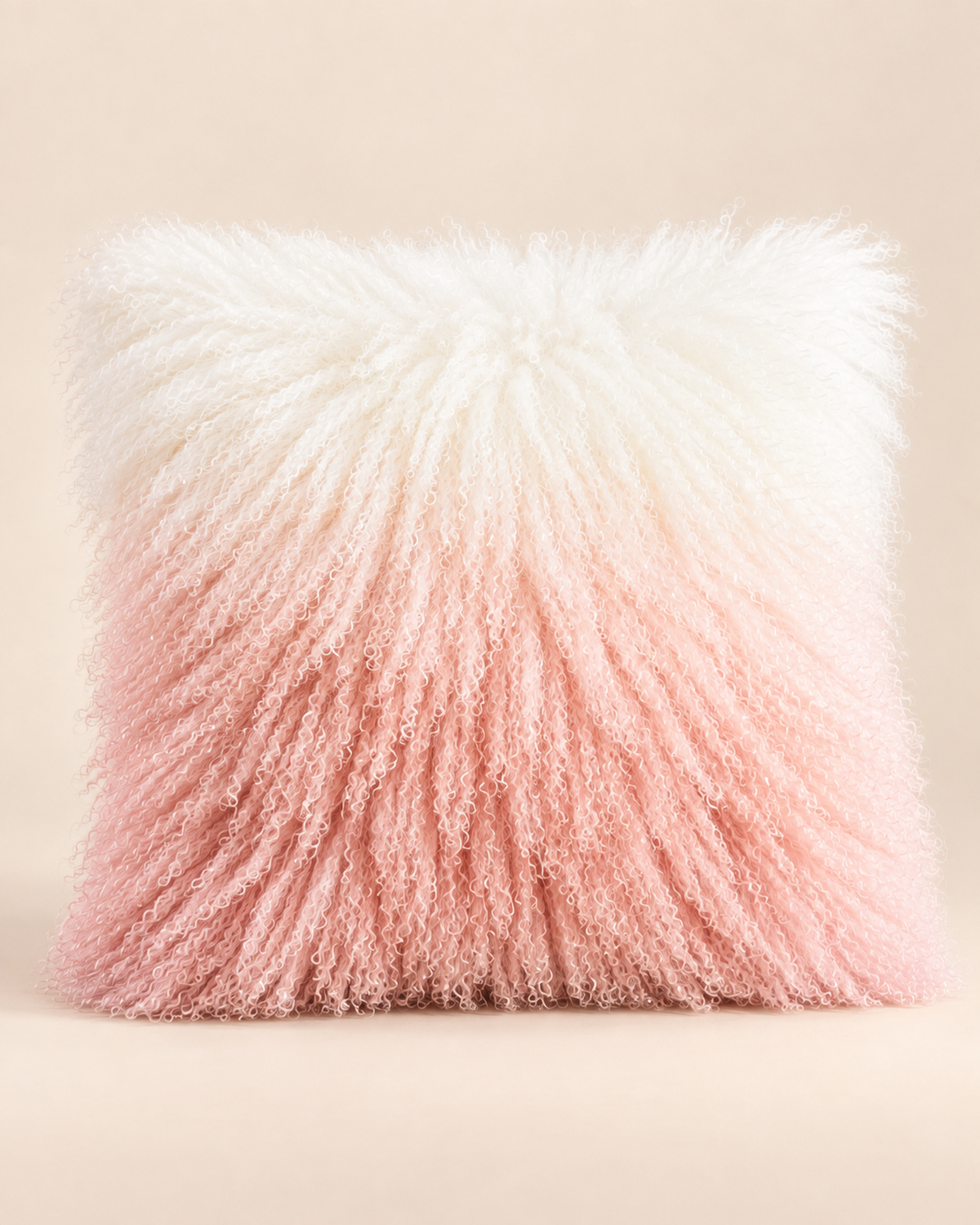 Single Pink Ombre Mongolian sheepskin cushion with ivory top and blush pink bottom